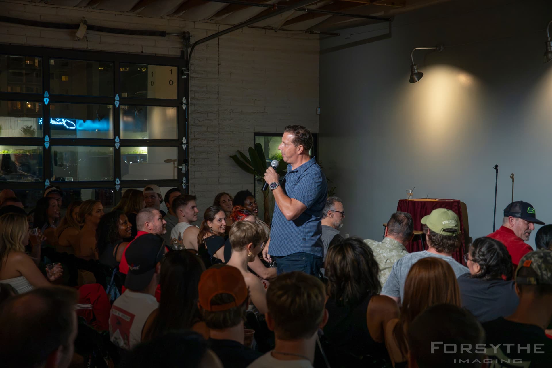 Aaron Bare working a packed room at Arizona After Dark